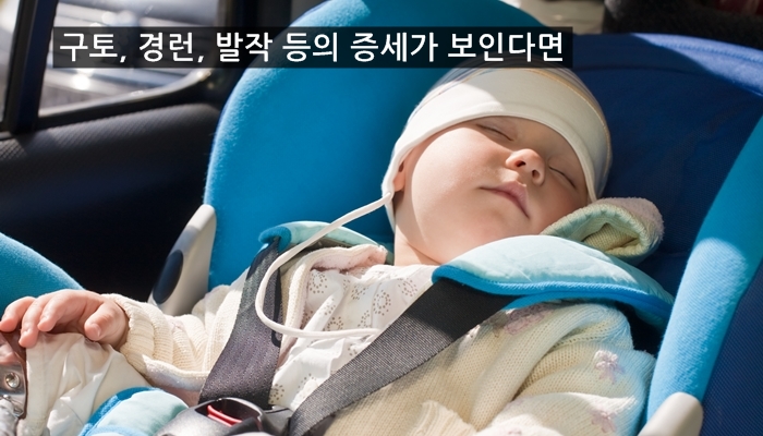 Toddler sleeping in a car seat